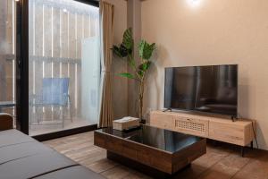 TV a/nebo společenská místnost v ubytování Funabori