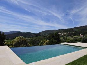 a swimming pool with a view of the mountains at Beautiful Ponte De Lima Villa 4 Bedrooms Villa Hermosa Vista Private Pool in Ponte de Lima +18 photos