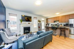 a living room with a couch and a fireplace at Brand New 7beds-kingbedsfamilysleep15playtable in Milton