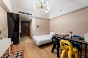 Łóżko lub łóżka w pokoju w obiekcie Manriver Executive Apartments