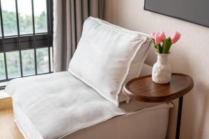 Łóżko lub łóżka w pokoju w obiekcie Manriver Executive Apartments
