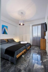 a bedroom with a large bed and a television at Luxury Cyprus Villa Turquoise Villa Private Pool Sea View Paphos in Paphos