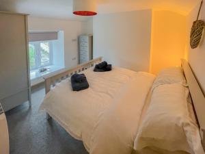 Voodi või voodid majutusasutuse Palm Cottage toas +7 fotot