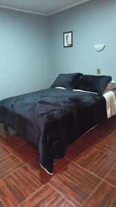 Cama o camas de una habitación en Lodge Atacama Hostal