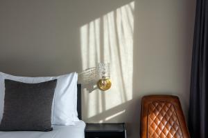 Letto o letti in una camera di Maxx Jeju, a member of H Rewards