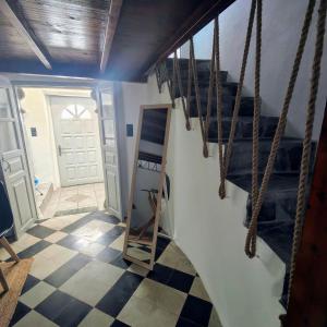 a stairway with a ladder in a room at Frida' s Mansion in Dhragoulás +17 photos