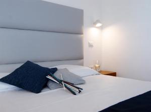 A bed or beds in a room at Relais Manfredi