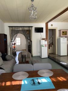a living room with a couch and a table at Mytilini Townhouse in Mytilene