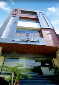 a building with a sign on the side of it at Hotel Skyla in Zirakpur