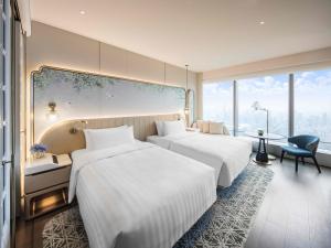 Voodi või voodid majutusasutuse Shangri-La Nanshan, Shenzhen, Stay for 2 consecutive nights and enjoy breakfast toas