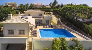 an aerial view of a house with a swimming pool at Villa Povo Do Burro, Beautiful And Elegant Villa, Few Minutes Walk To Resort in Carvoeiro