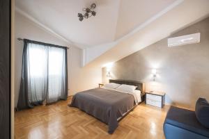 Postel nebo postele na pokoji v ubytování Apartments Škara