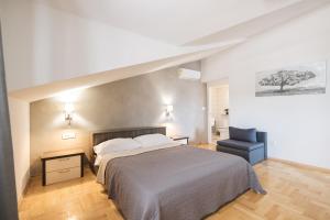 Postel nebo postele na pokoji v ubytování Apartments Škara
