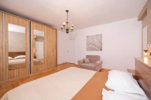 Postel nebo postele na pokoji v ubytování Apartments Škara