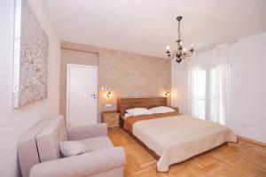 Postel nebo postele na pokoji v ubytování Apartments Škara