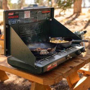 a grill with a pan of food on a table at Hawaiian Overlanders in Kailua-Kona