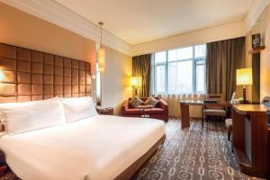 Un pat sau paturi într-o cameră la Sichuan Jinjiang Hotel +284 fotografii