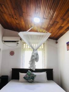 Postel nebo postele na pokoji v ubytování Casa Del Ceylon