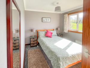 Postel nebo postele na pokoji v ubytování Gean Cottage
