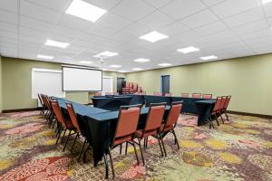 a conference room with a long table and chairs at Comfort Suites Columbia at Harbison in Columbia +30 photos