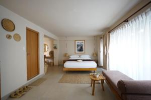 Postel nebo postele na pokoji v ubytování Artelier's Home