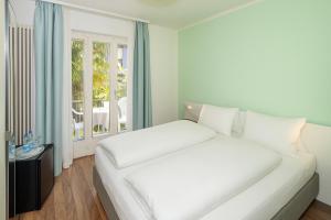 Postelja oz. postelje v sobi nastanitve Hotel Garni dei fiori