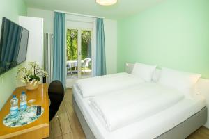 Postelja oz. postelje v sobi nastanitve Hotel Garni dei fiori
