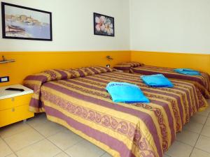 Posteľ alebo postele v izbe v ubytovaní Villaggio Hemingway - Family Aparthotel