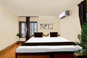 Postel nebo postele na pokoji v ubytování Hotel O Delight Rooms + 21 fotografií