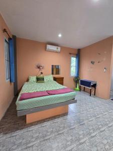 a bedroom with a large bed in a room at Cozy Modern House, Top Spot in Baan Tai