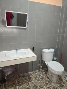a bathroom with a toilet and a sink at Cozy Modern House, Top Spot in Baan Tai
