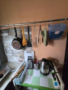 a kitchen counter with a stove and some utensils at Cozy Modern House, Top Spot in Baan Tai +4 photos