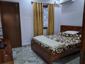 Postel nebo postele na pokoji v ubytování Monteiro Guesthouse