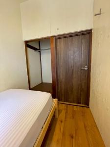 Ένα ή περισσότερα κρεβάτια σε δωμάτιο στο Nomad Hostel Classic
