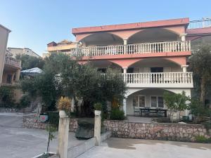 a large building with a balcony on top of it at Studio Sea View Steps to Przno beach w Parking Villa Olive in Pržno +22 photos