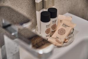 a counter with a shelf with products on a sink at Hospedería Quinta de Cavia in Cabia