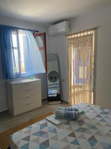 Postel nebo postele na pokoji v ubytování Stamatis Rooms