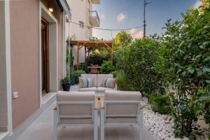a row of chairs sitting on a patio at Avli in Preveza