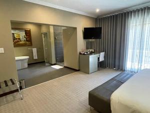 Ένα ή περισσότερα κρεβάτια σε δωμάτιο στο St Andrews Hotel and Spa