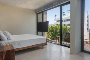 En eller flere senge i et værelse på MK Playa del Carmen + 36 billeder