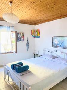 Postel nebo postele na pokoji v ubytování Stamatis Rooms