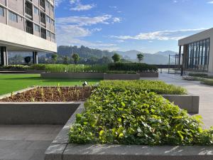 a garden in the middle of a building at Pool View Studio - 168 Park Selayang in Batu Caves