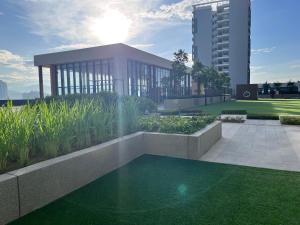 a rendering of a building with a fountain in a garden at Pool View Studio - 168 Park Selayang in Batu Caves