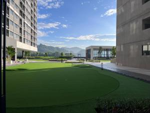 a rendering of a green lawn in front of a building at Pool View Studio - 168 Park Selayang in Batu Caves