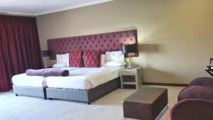 Ένα ή περισσότερα κρεβάτια σε δωμάτιο στο St Andrews Hotel and Spa