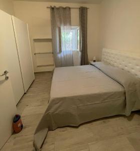 Ένα ή περισσότερα κρεβάτια σε δωμάτιο στο Casa Giulia