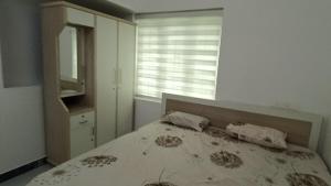 Ένα ή περισσότερα κρεβάτια σε δωμάτιο στο White Cloud Homestay Attappadi Jellippara