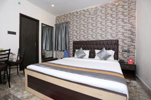 Postel nebo postele na pokoji v ubytování Collection O Church View Near St. Thomas's Church