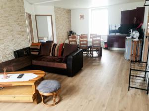 a living room with a couch and a table at Cramiland - Super appart 5 pers centre ville in Montbéliard