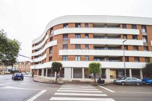 a building with a sign on the side of it at Avalón I By Silastur in Villaviciosa +38 photos
